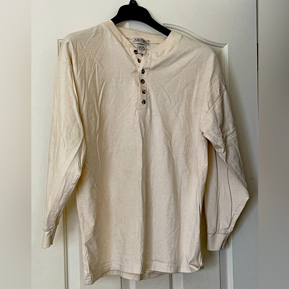 Man’s long sleeve T-Shirt. 27”neckline to tail. 24” across the chest.Sleeves 21”